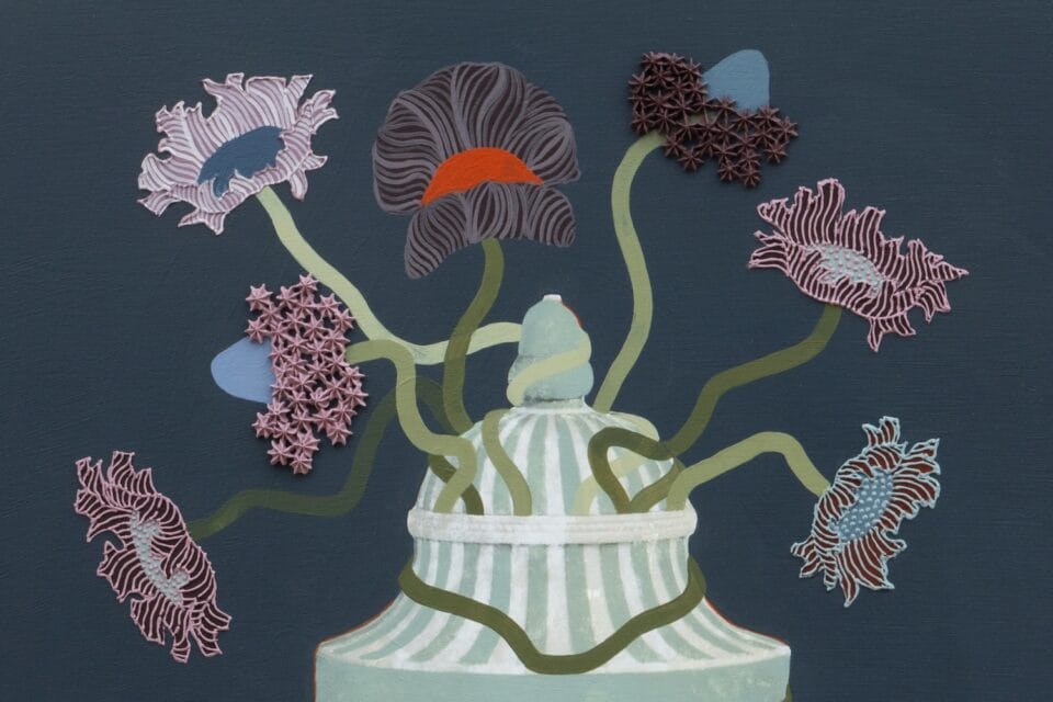 a detail of a still life with textured flowers held in a blue ornate vessel