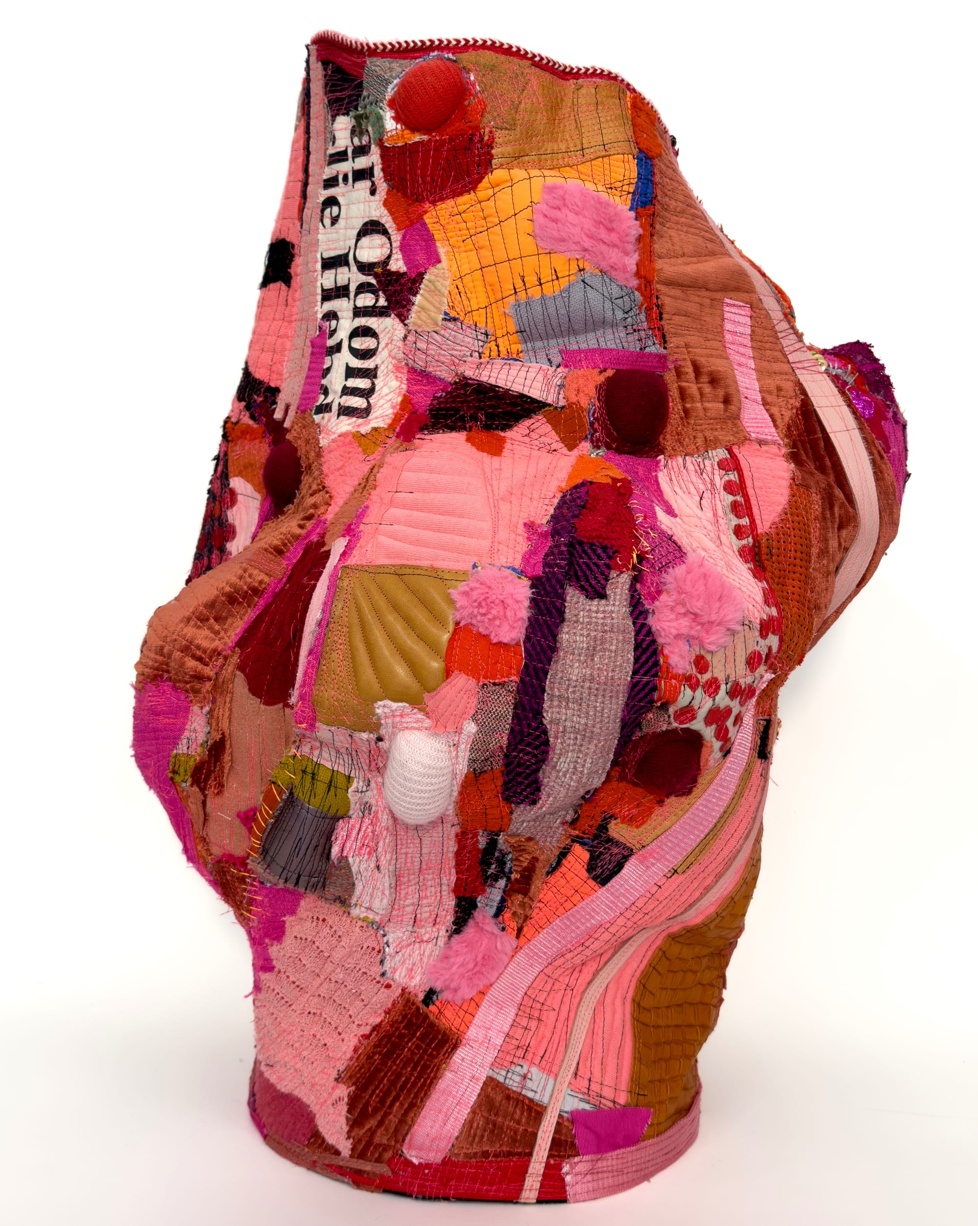 a vessel made of pink, red, and orange fabrics