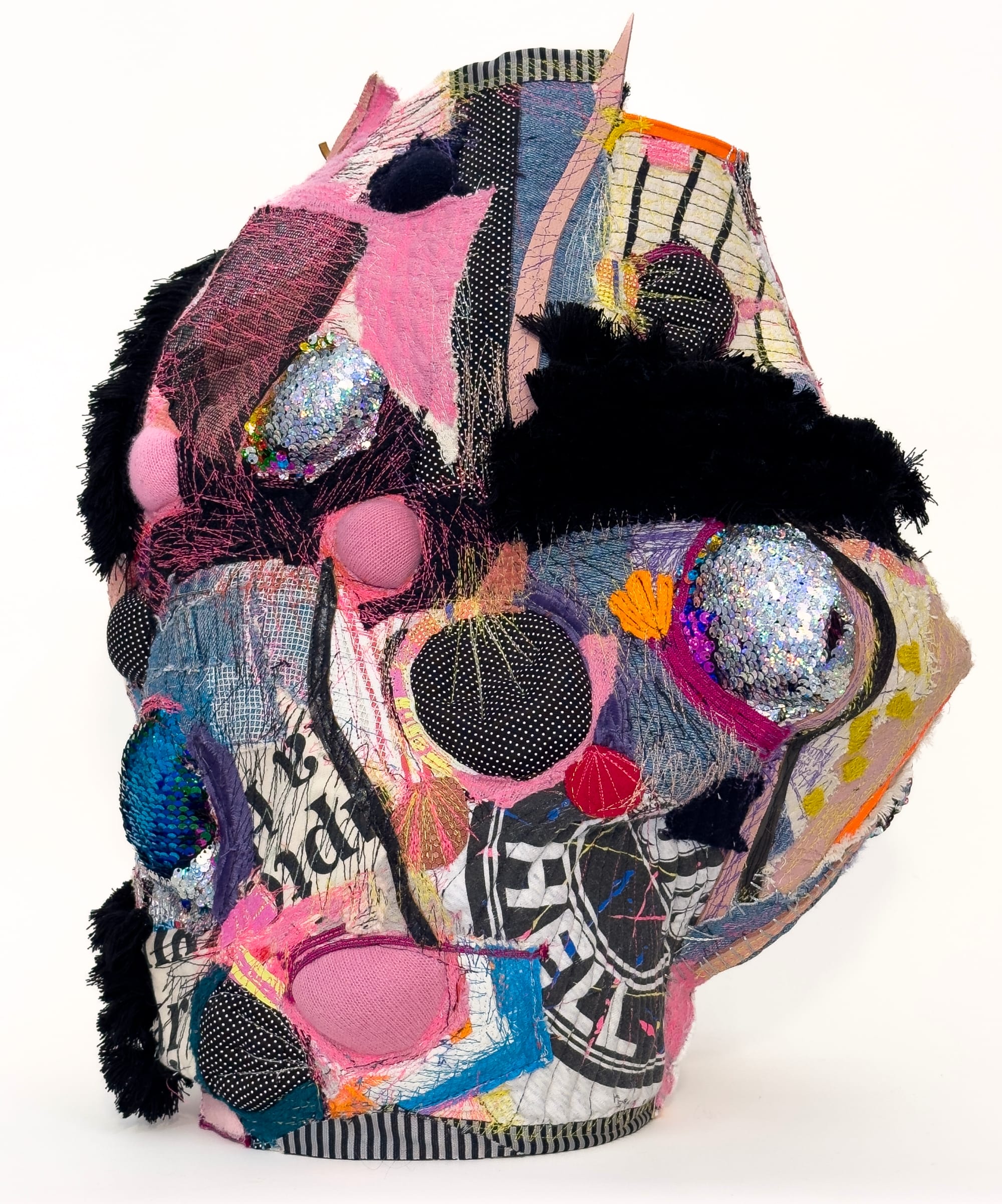a vessel made of pink, black, and blue fabrics