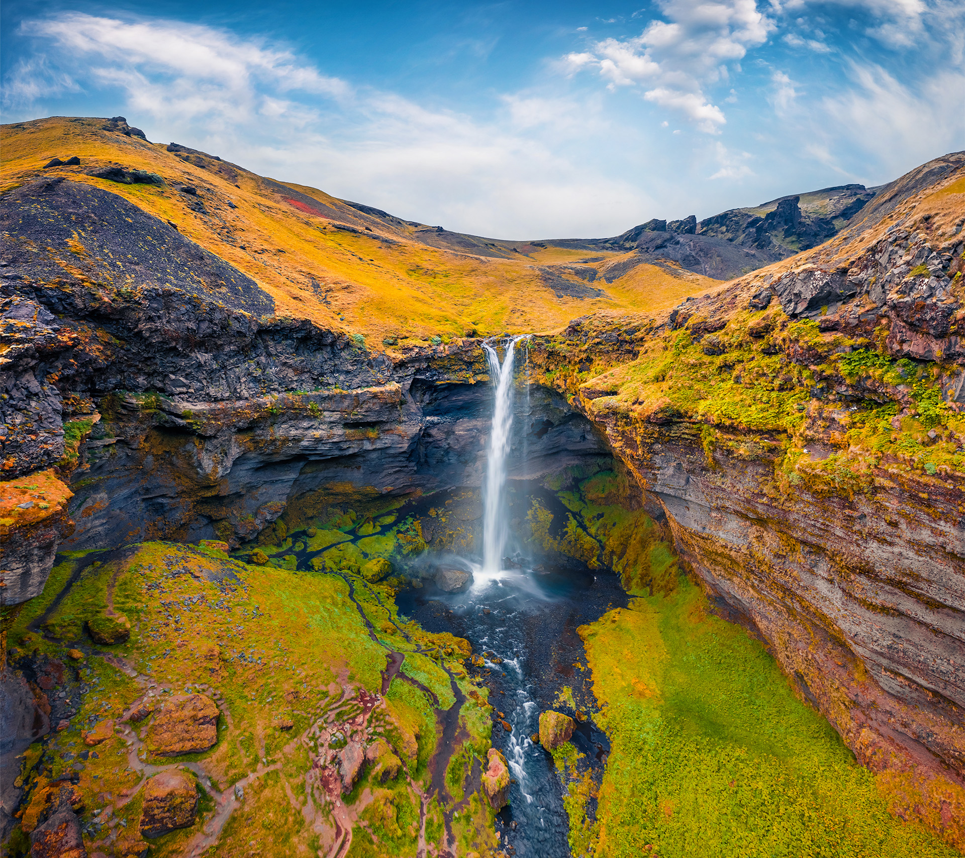 Aerial landscape photography. Awesome summer view from flyind drone of Kvernufoss watterfall. Superb morning scene of pure water river in Iceland, Europe. Beauty of nature concept background.