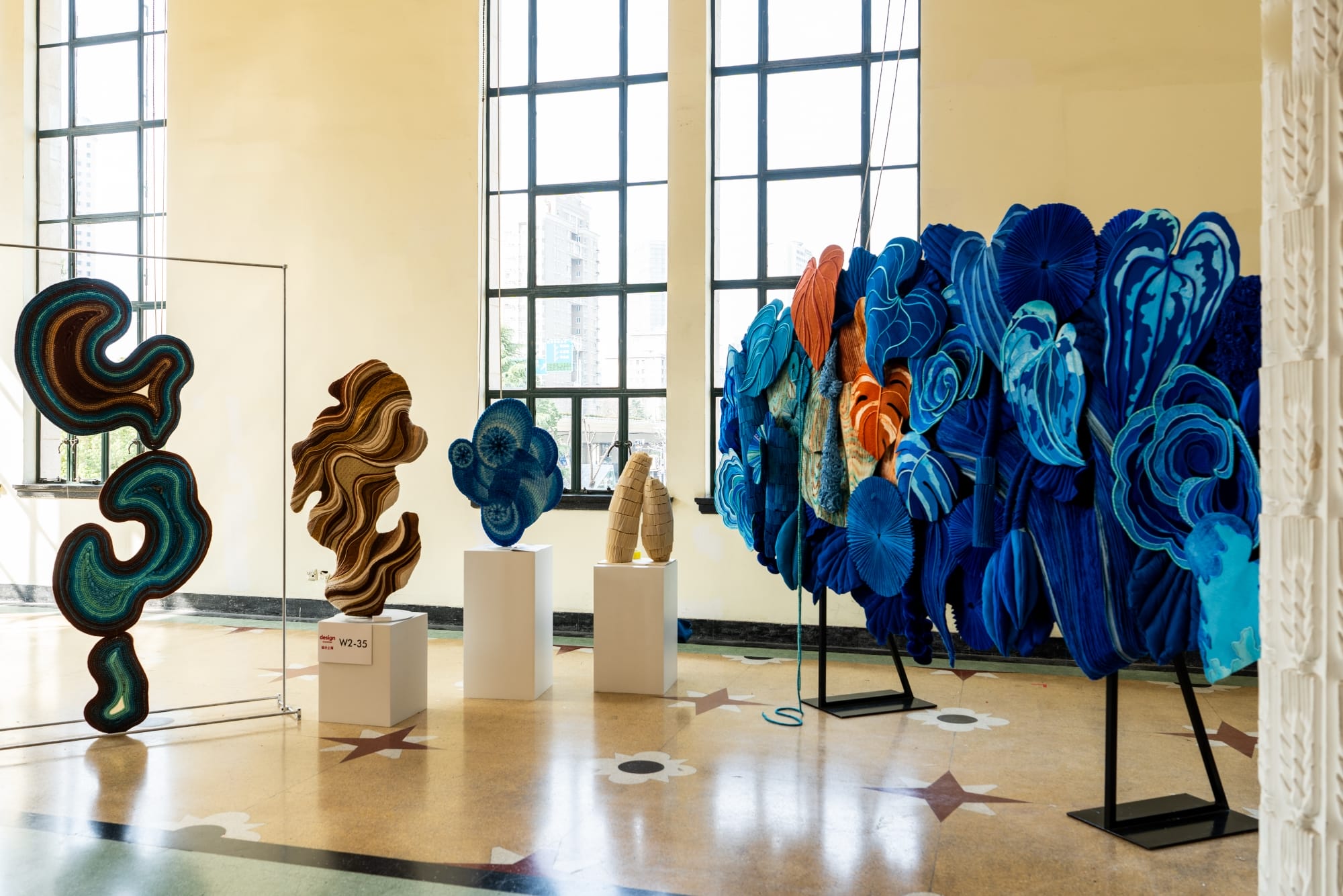 an installation view of several sculptural textile works